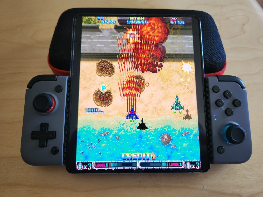 Samsung Galaxy Z Fold5 in tablet mode, with a game controller attached.
